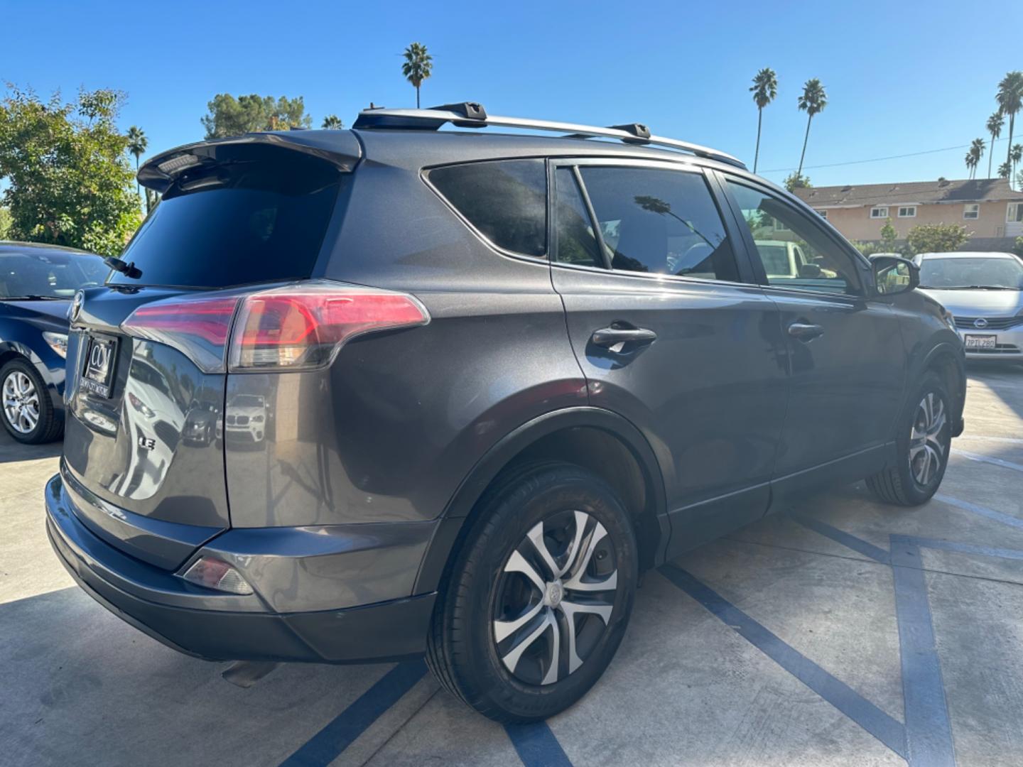 2016 Gray /Black Toyota RAV4 (JTMZFREVXGJ) , AUTOMATIC transmission, located at 30 S. Berkeley Avenue, Pasadena, CA, 91107, (626) 248-7567, 34.145447, -118.109398 - Crown City Motors is a used “Buy Here Pay Here” car dealer in Pasadena CA. “Buy Here Pay Here” financing, means that when you purchase your vehicle from our dealership, that you make the payments to the dealership as well. We do not need the banks approval to get you approved for a used auto - Photo#4